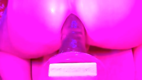 I'm playing with a doll toy with a large dildo in amateur solo video